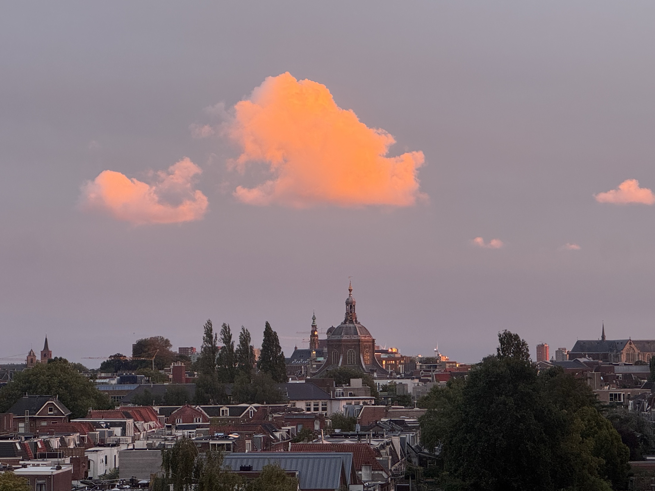 Leiden skyline under sunset clouds